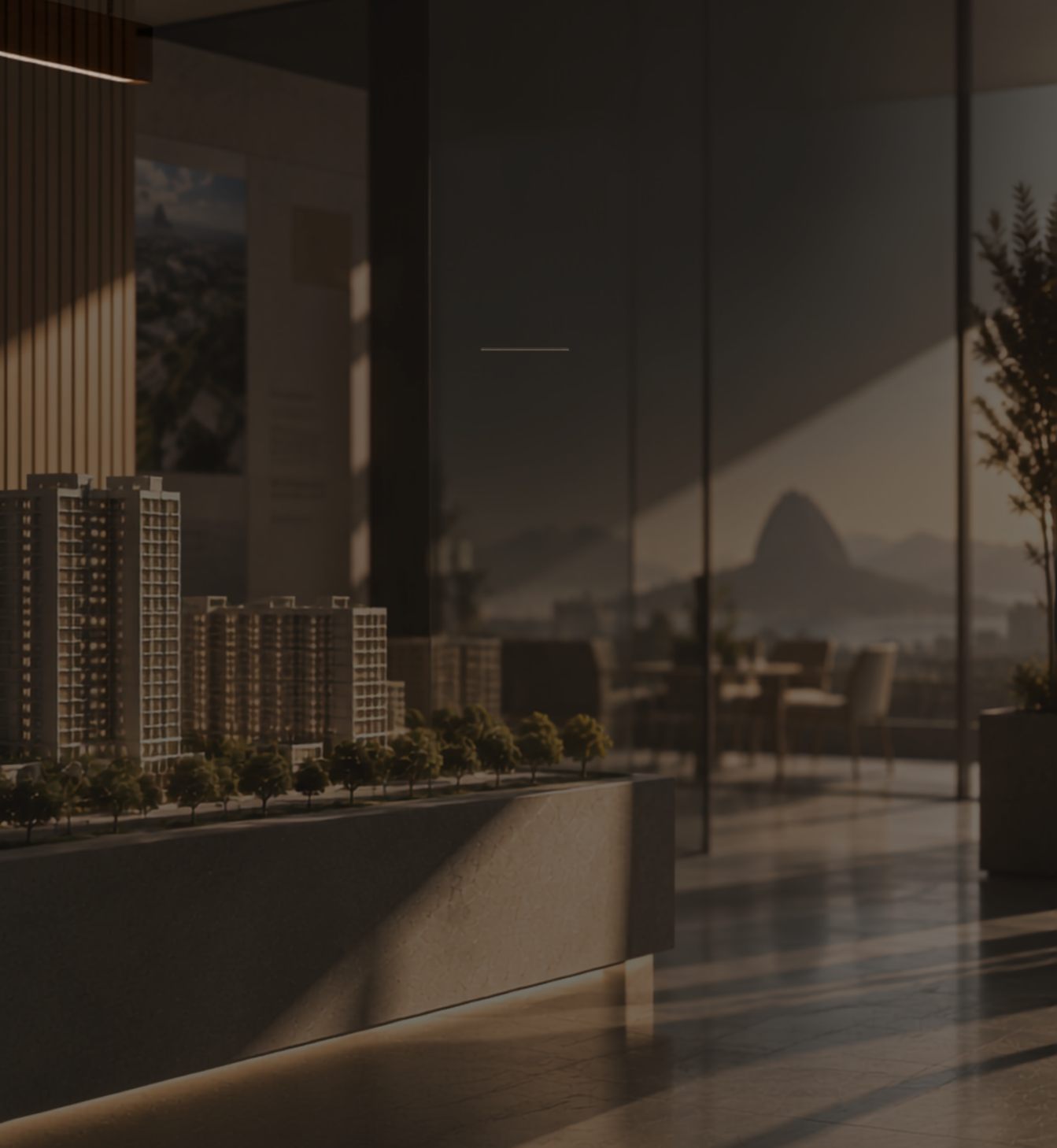 Stand de vendas com maquete de empreendimento e vista para o Pão de Açúcar